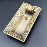 Antique gold Art Deco metal cigar ashtray with geometric border design