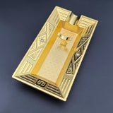 Bright gold Art Deco metal cigar ashtray with raised cigar rest and deep tray