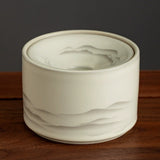 Misty Mountains ceramic ashtray with funnel lid on wooden surface