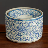 Blue floral ceramic ashtray on wooden surface