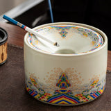 Ceramic ashtray with funnel lid and cigarette on dark tabletop