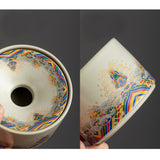 Close-up views of decorative ceramic ashtray showing lid opening and side pattern