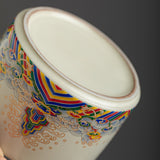 Side view of colorful ceramic ashtray with glazed finish