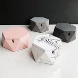 set of hexagon cement ashtrays in white gray black and pink minimalist design