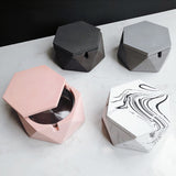 hexagonal cement ashtray with lid open showing inner compartment
