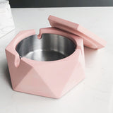 pink hexagon ashtray with removable stainless steel inner tray close up
