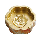 Sunset marble flower shaped ashtray with gold-tone interior and raised rose design