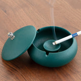 Matte Teal ceramic ashtray with lid, cigarette rests, and middle pedestal