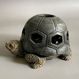 Front view of rustic turtle ashtray with detailed shell design and tortoise body