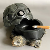 Turtle ashtray with open bowl and cigarette resting through shell opening