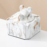 White gold covered ceramic ashtray with ram head knob and raised relief side design