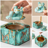 Turquoise gold covered ceramic ashtray with removable ram head lid, gold-tone interior, and versatile storage use