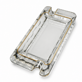 Clear gold trim crystal glass cigar ashtray with dual cigar rests on white background