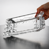 Clear crystal glass cigar ashtray being held to show thick faceted glass and polished finish