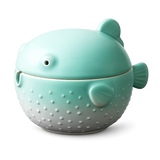 Cute green ceramic pufferfish ashtray with lid on white background