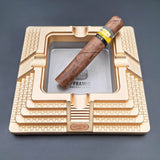 Antique gold Egyptian pyramid metal cigar ashtray with cigar for home bar or cigar lounge
