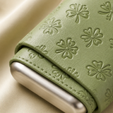 Close-up of embossed floral leather texture and protective metal base