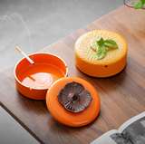 Fruit inspired ceramic ashtray with removable lid and cigarette rests