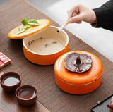 Fruit inspired ceramic ashtray with removable lid and cigarette rests