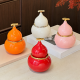 Gourd-shaped ceramic ashtray color options in orange white pink and red