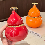 Red and orange gourd-shaped ceramic ashtrays with lids for indoor and outdoor tabletop use