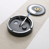 Round yin-yang stone ashtray with removable lid and cigarette rest grooves