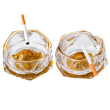 Gold iceberg glass ashtray with gold rim, thick clear glass body, and cigarette rests