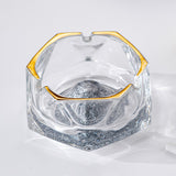 Silver iceberg glass ashtray with gold rim, deep bowl, and cigarette holder grooves