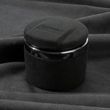 Maroon LED car ashtray with lid on black fabric
