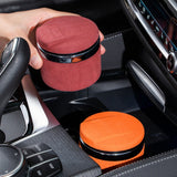 Car ashtrays with lids shown in use inside a vehicle