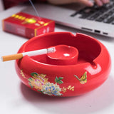 Red ceramic ashtray open with cigarette, large floral ashtray for outdoor smoking