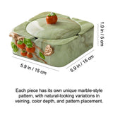 Sage green lidded ceramic ashtray with persimmon accent and marble-look pattern variation note