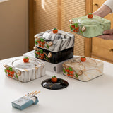 Lidded ceramic ashtrays with persimmon accent styled on a table for home smoking area decor