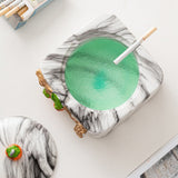 Open lidded ceramic ashtray showing removable lid, cigarette rests