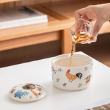 Pouring water into a rooster pattern ceramic ashtray
