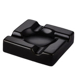 Black electroplated ceramic cigar ashtray isolated on light background