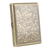 Vintage engraved steel cigarette case with antique finish on white background