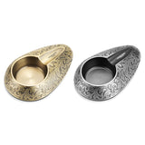 Antique gold and gunmetal silver engraved cigar ashtray color options on white background