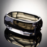 Smoked quartz faceted crystal glass ashtray on reflective surface