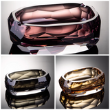 Collage of amethyst rose, smoked quartz, and champagne amber crystal glass ashtrays
