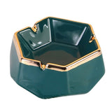 Emerald green ceramic ashtray with gold trim and 3 grooves to rest cigarettes