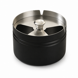 Short black covered stainless steel ashtray with brushed metal lid and cigarette rests