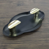 Matte black and gold stainless steel cigar ashtray with dual raised rests