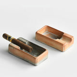 Two rectangular ceramic cigar ashtrays showing different glaze patterns