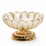 Champagne scalloped glass ashtray with ornate gold metal base on white background