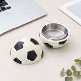 Soccer ball covered ashtray with silver removable metal tray on minimalist desk