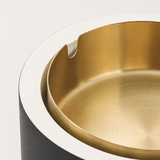 Close-up of gold removable metal tray inside soccer ball covered ashtray