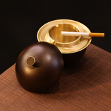 Dark Bronze covered ashtray with gold interior and removable lid