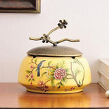 Yellow ceramic ashtray with lid and bird floral garden design