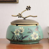 Teal ceramic ashtray with lid and white flower design